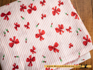 Remnant (Cotton) Red & White Fabric with Bows & Bells (5 yds)