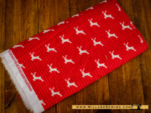 Remnant (Cotton) Solid Red Fabric with White Reindeers (1 yd)